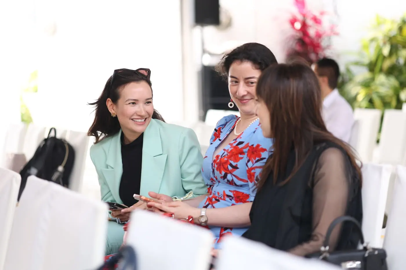 Genesis members in conversation at a member gathering
